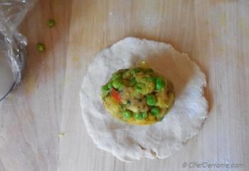 Step for Recipe - Spiced Potatoes and Peas Stuffed Flat Bread with Preserved Lemons