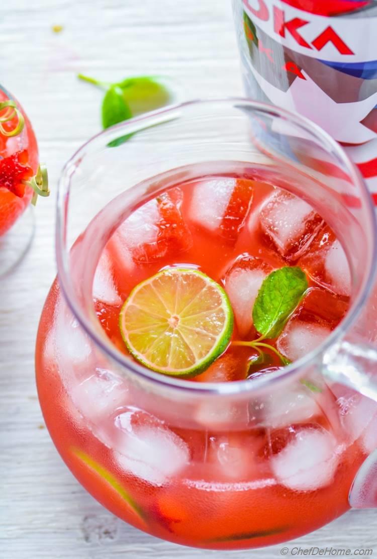 Pitcher filled of party style refreshing Strawberry Agua Fresca cocktail for 4th July Red White and Blue Theme Party | chefdehome.com