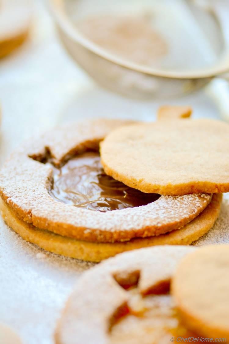 Make decorated Big Apple Linzer Cookies, and use Apple cut-outs as other set of cookies for special touch in gifts pouch! 