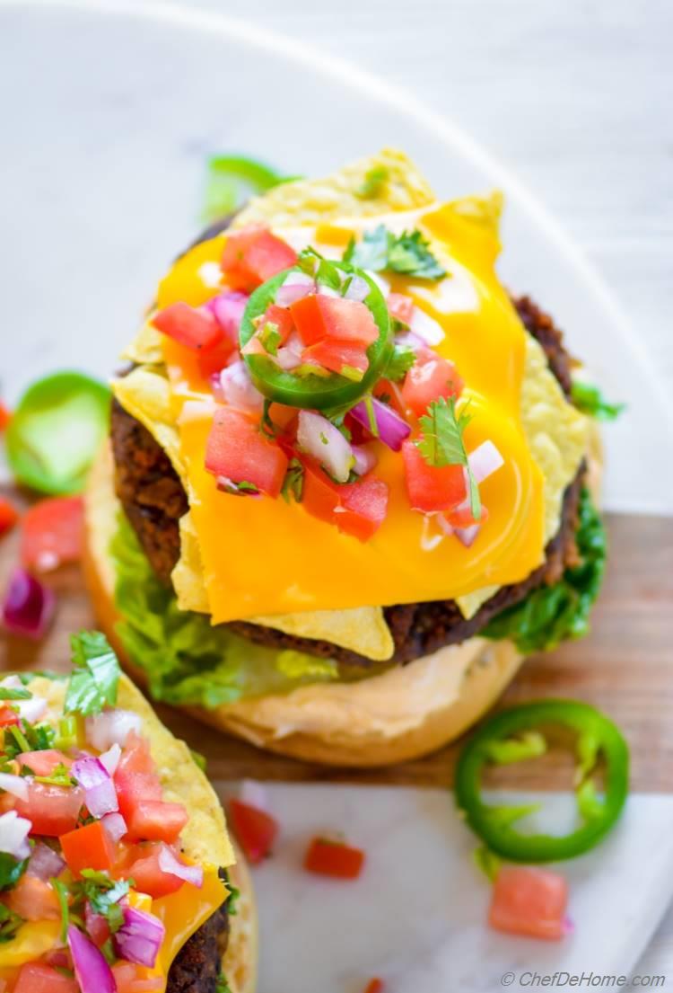 Veggie Black Bean Burger served Mexican Nacho Cheese crunch style with salsa chips and cheese | chefdehome.com
