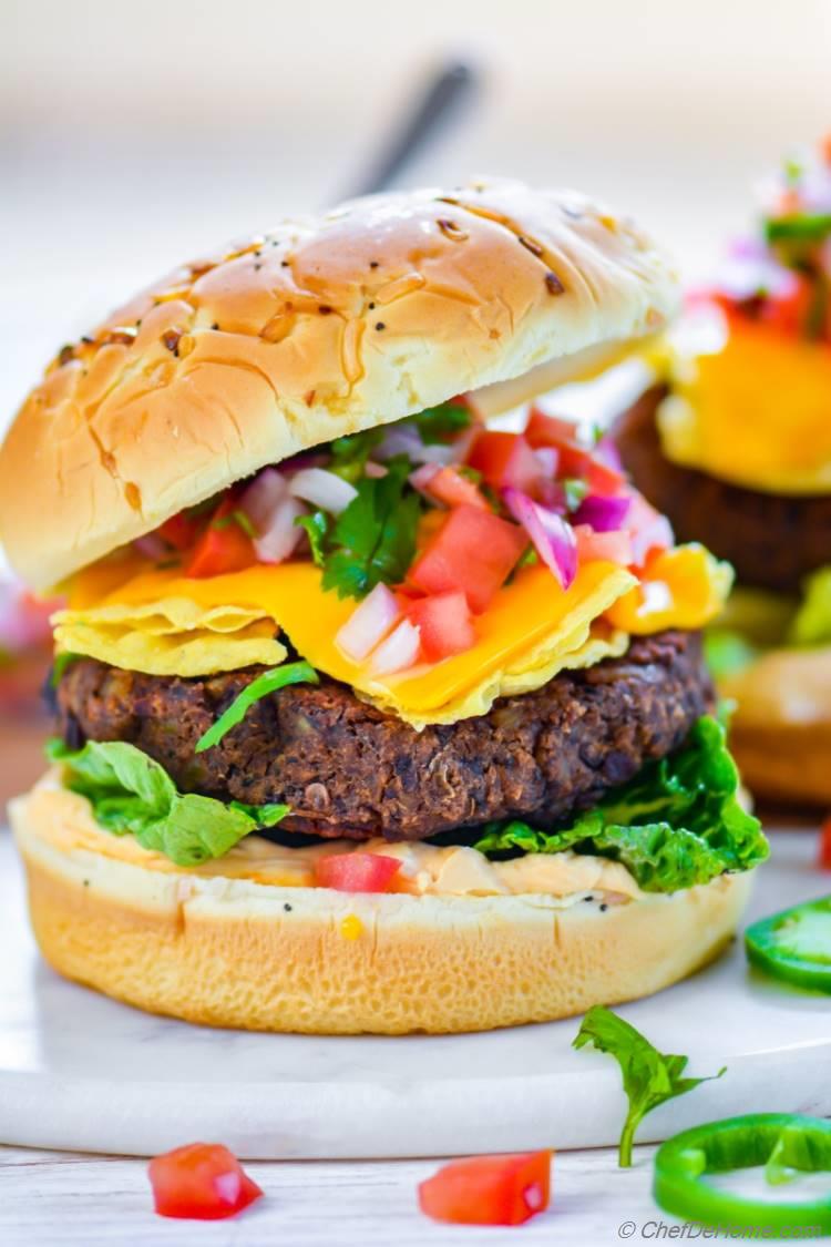 Veggie Black Bean Burger Patties topped with Mexican Nacho Cheese for a crunchy surprise | chefdehome.com