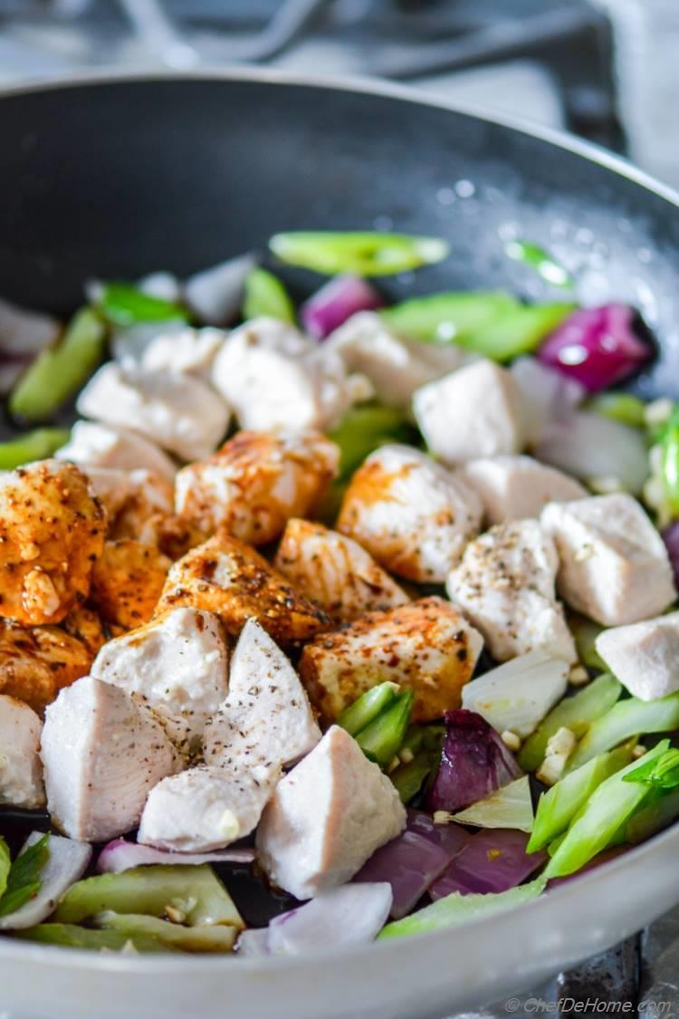 Moist Chicken cooking in Black Pepper sauce with crunchy celery and scallions | chefdehome.com