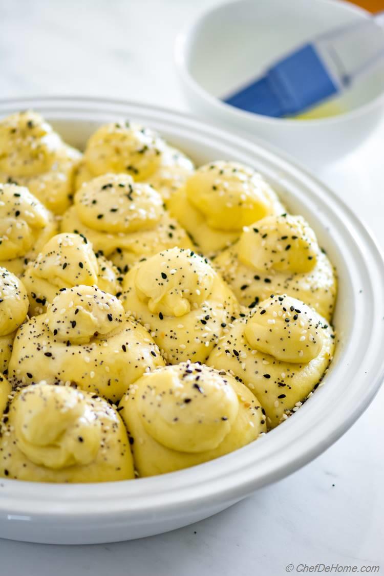 Rolled Dinner Rolls rising in pie pan