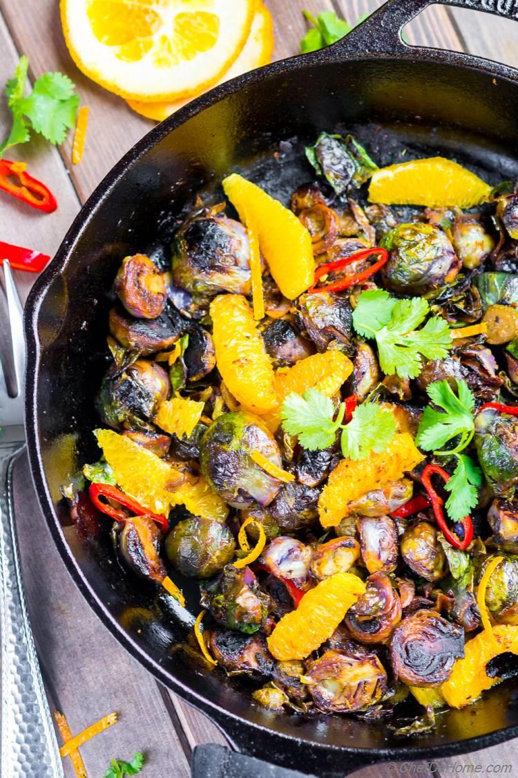 Charred Brussel Sprouts Cooked in Skillet with chilies orange and soy sauce