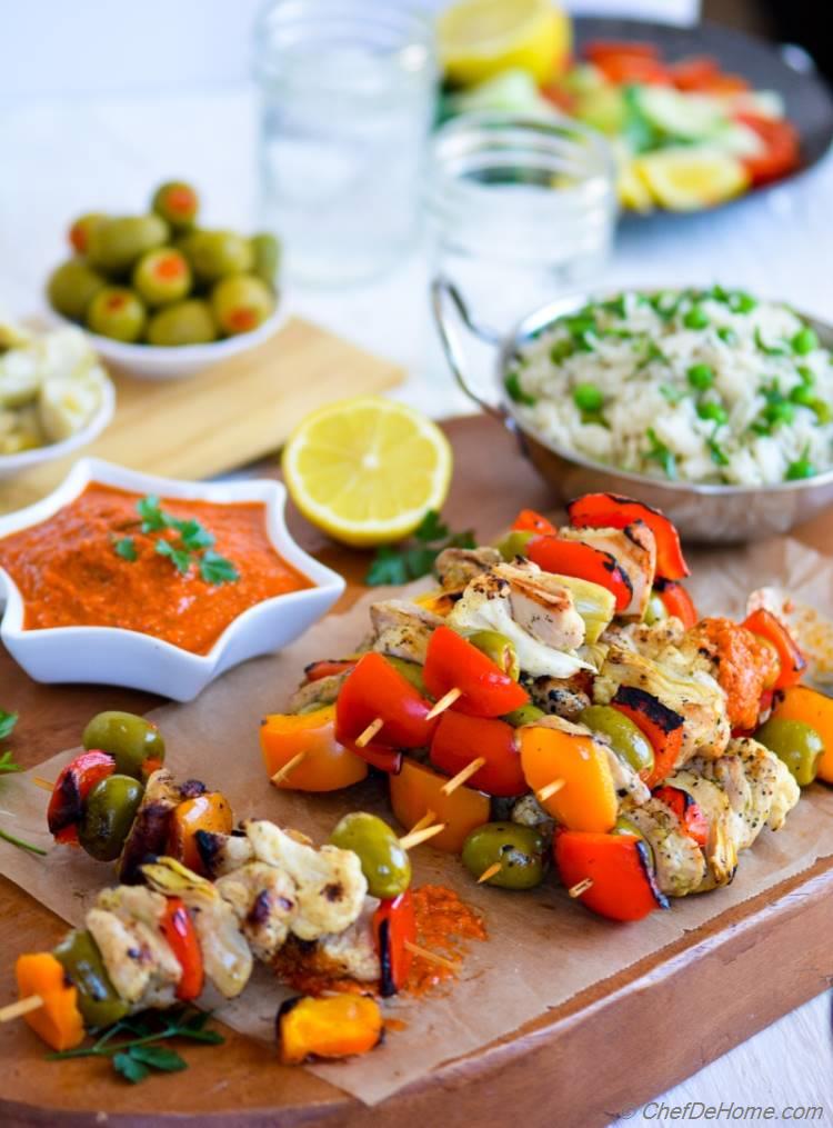 Grilled Chicken Kabobs with Romesco Sauce and Green Pea Pilaf | chefdehome.com