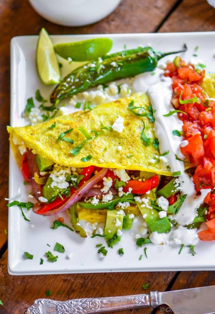 Chicken Breakfast Omelette with healthy fajita filling spicy salsa and avocado | chefdehome.com