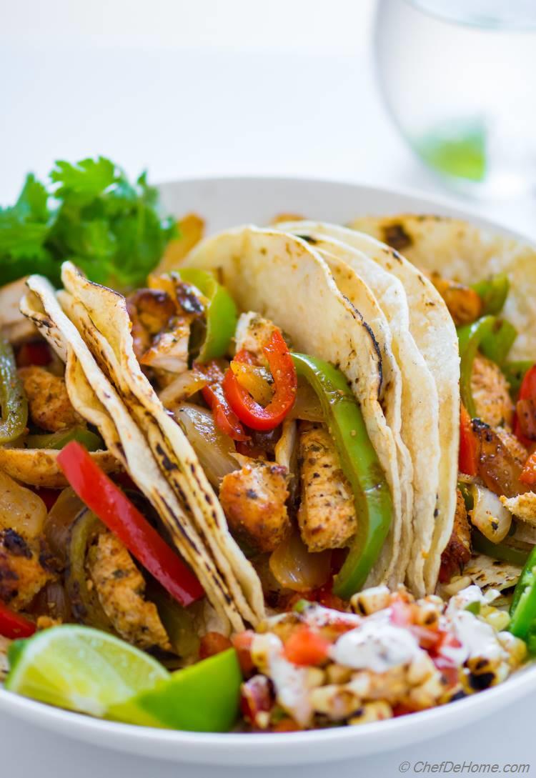 Chicken Fajita with sauted peppers and onions and tortillas in tacos