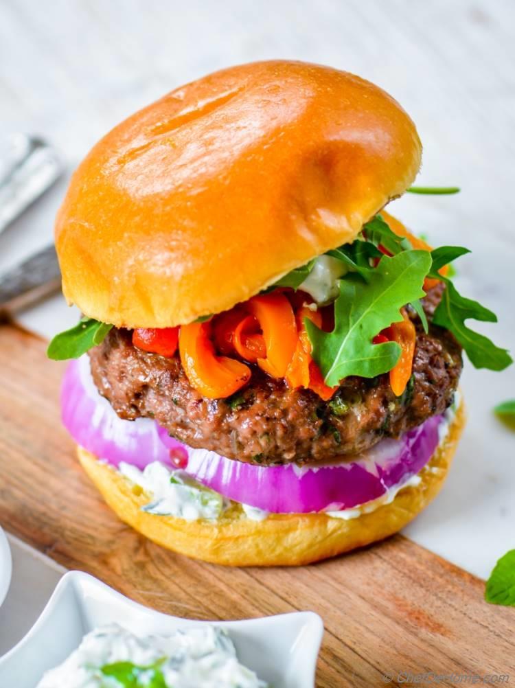 Greek Mint and Lamb Burgers with roasted red peppers cucumber yogurt sauce and arugula | chefdehome.com