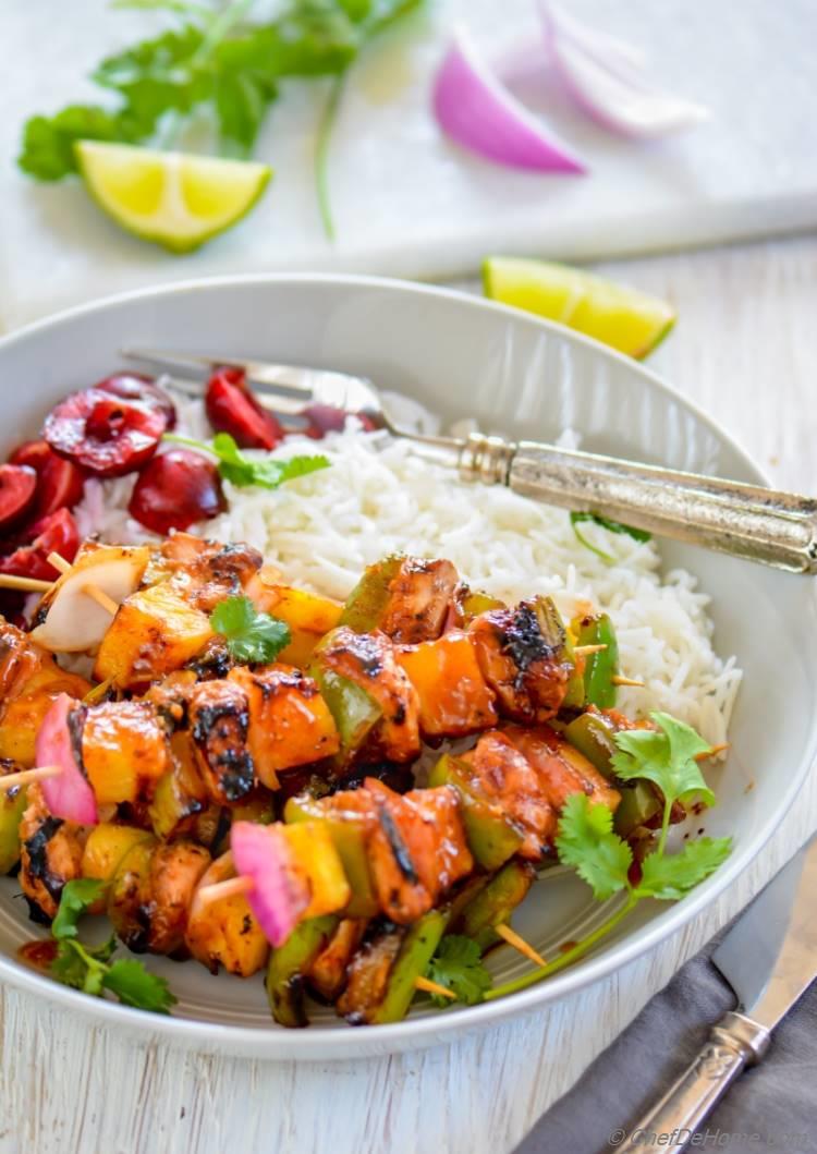 Grilled Hawaiian Chicken Skewers with pineapple marinade and side of rice and cherry salad | chefdehome.com