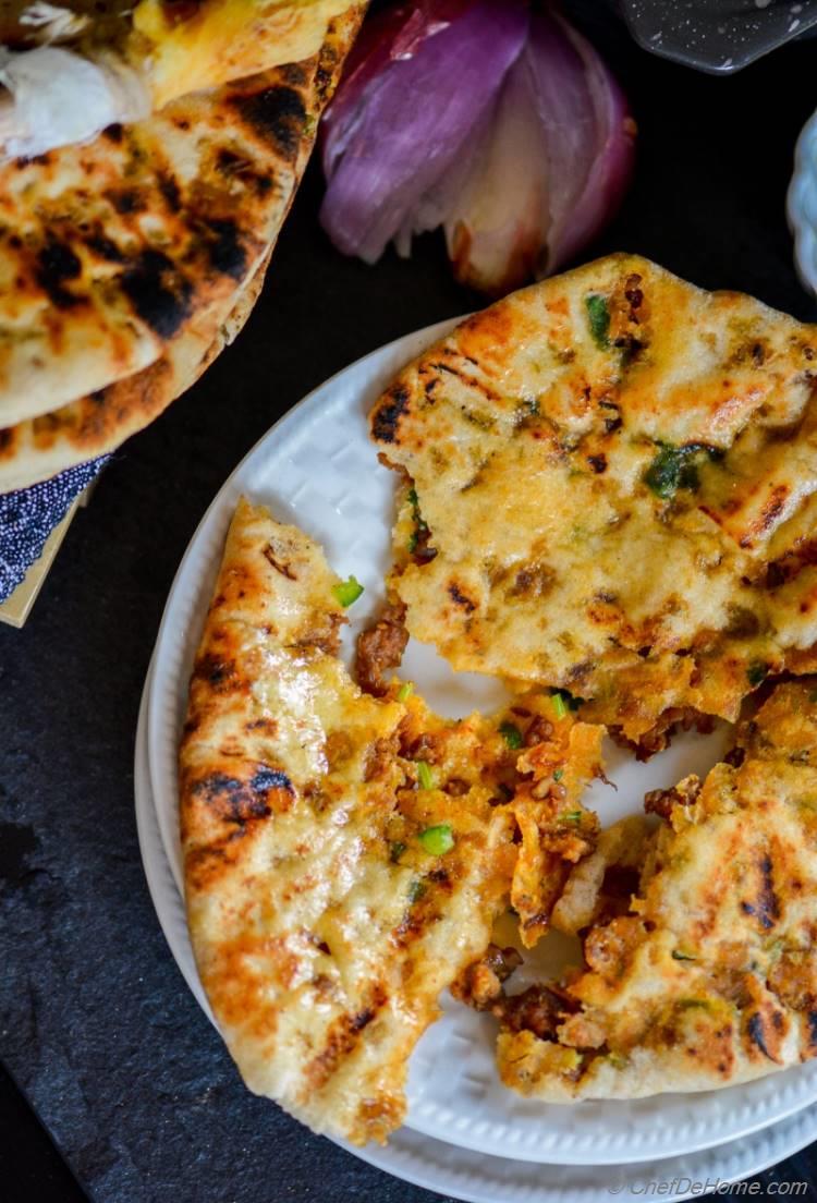 Restaurant-Style Homemade Indian Keema Naan Bread Served with Smashed Onion and Raita | chefdehome.com