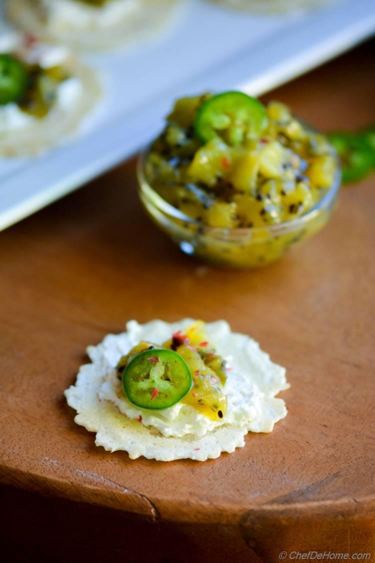 a 15 minute easy appetizer with homemade zesty Kiwi Chutney topped on gluten free rice crackers 