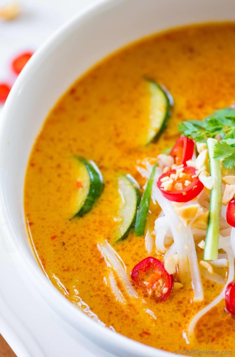 Rich and flavorful coconut curry broth of Laksa Soup | chefdehome.com