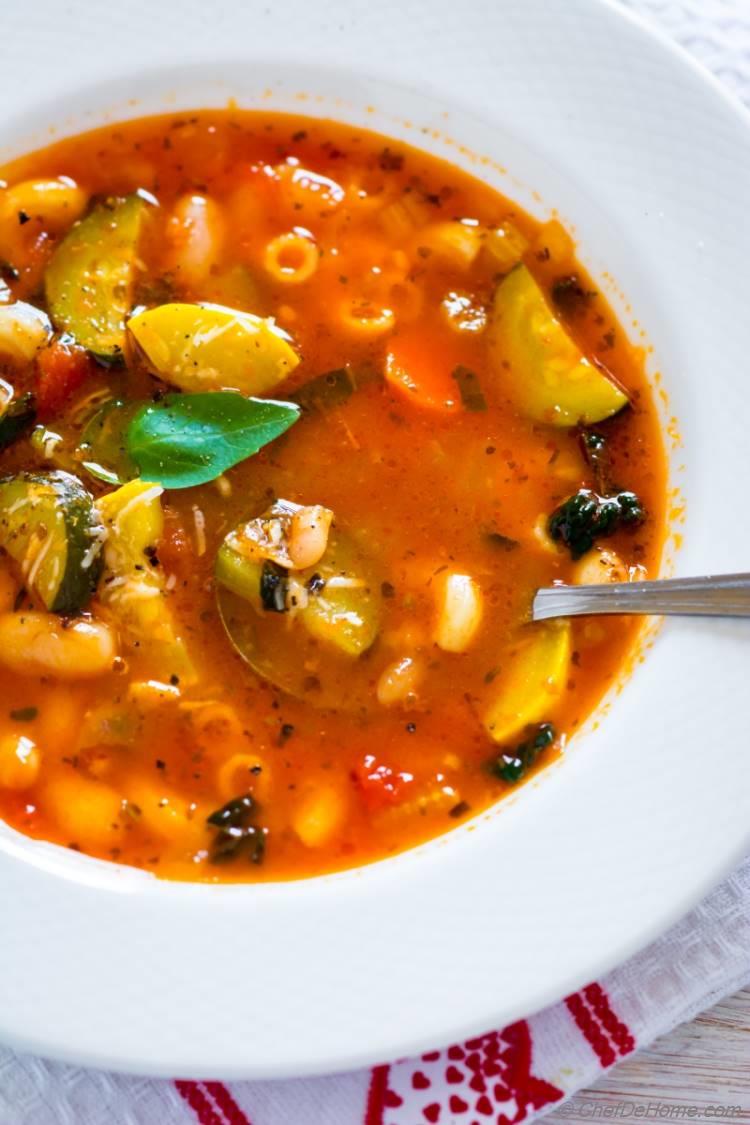 Bowl of Minestrone Soup with fresh basil and parmesan cheese