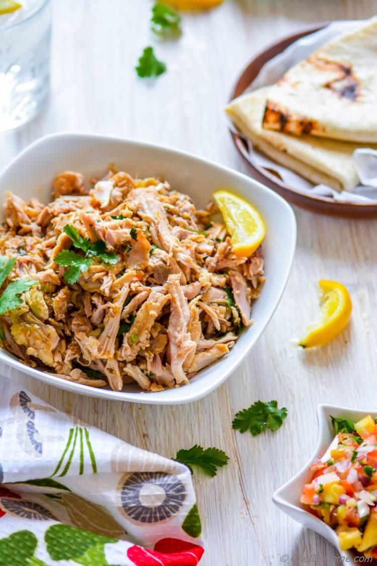 all prepared in slow cooker shredded Juicy Mojo Chicken perfect for lite summer dinner | chefdehome.com