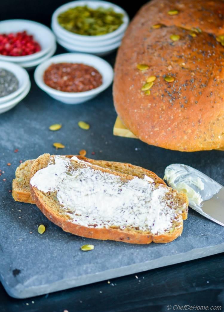 A lite and airy whole seeds healthy breakfast bread with lite smear of cream cheese | chefdehome.com