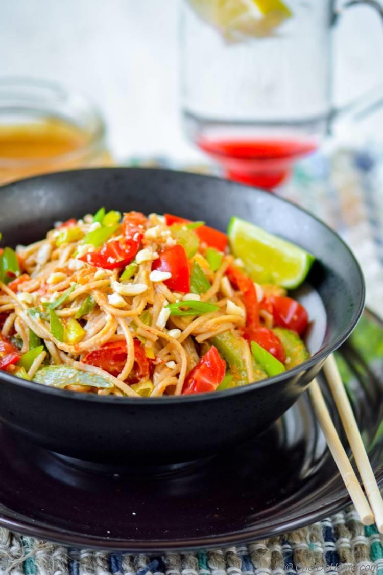 Asian Buckwheat Noodles sauteed in Veggies and Sweet and Spicy Peanut Sauce Served with Lime Wedges | Vegan and Gluten Free | chefdehome.com