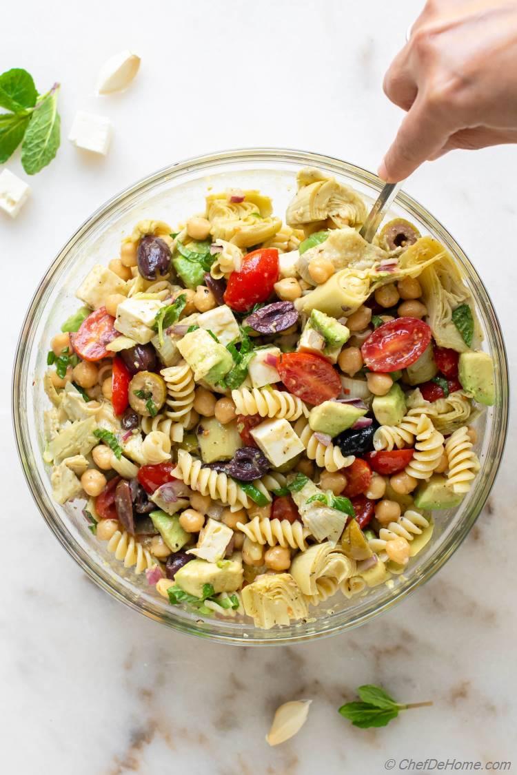 Assembling Pasta Salad with Chickpeas