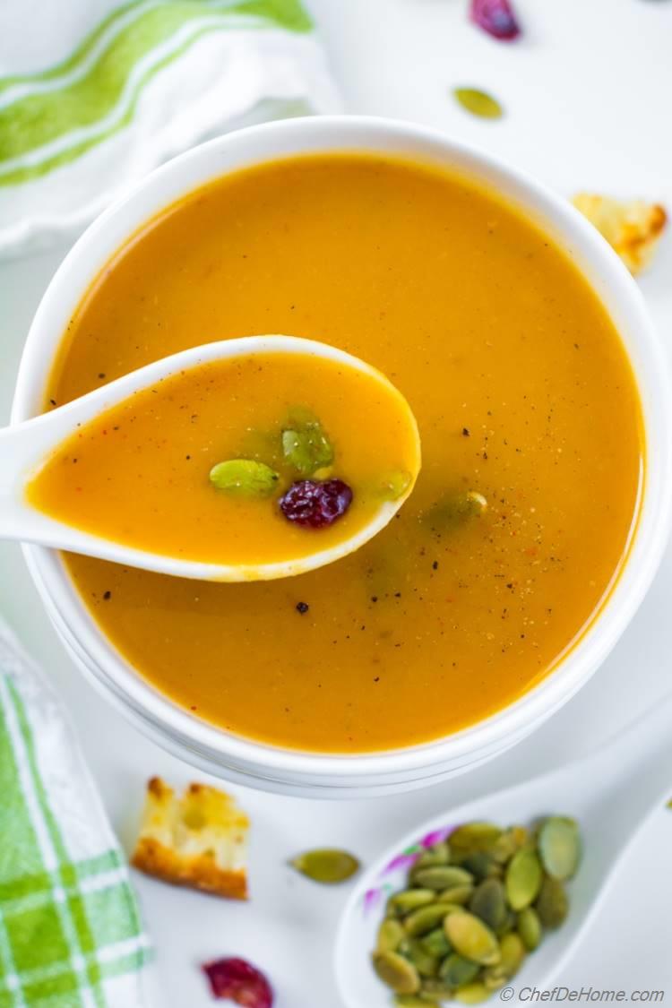 Creamy Roasted Butternut Squash Soup in bowl with spoon