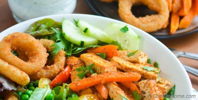 Tofu and Sweet Potato Fries Shawarma Salad Bowl with Onion Ring Croutons