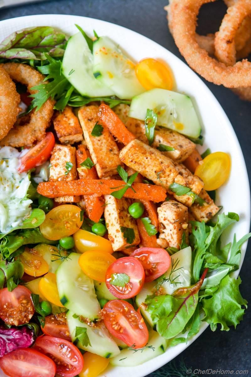 Tofu and Sweet Potato Fries Shawarma Salad Bowl with Onion Ring
